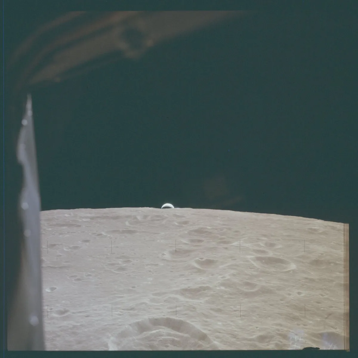 9 - A sliver of Earth is visible over the edge of the moon