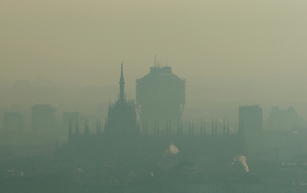 2-Milan's Duomo Cathedral in Italy is barely visible through smog
