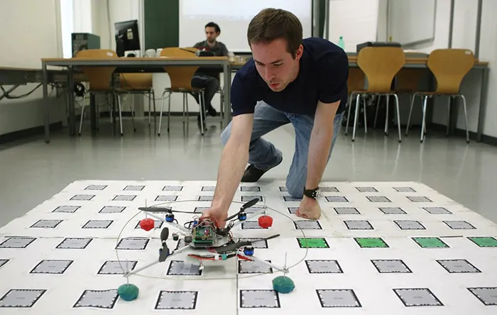 9-austria-Student-Michael-Leichtfried-of-the-Virtual-Reality-Team-at-Vienna-University-of-Technology-places-a-quadcopter-on-a-map-marked-with-computer-readable-symbols