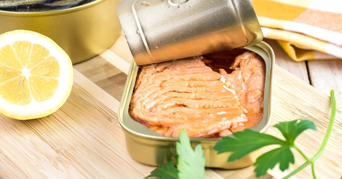 Open canned fish. Tin can with smoked salmon fillets. Canned Salmon Recipes