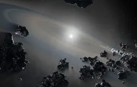 تصویری از بقایای یک منظومه سیاره‌ای باستانی و مرده که به دور یک ستاره کوتوله سفید می‌چرخد. محاسبات جدید نشان می‌دهد که کوتوله‌های سفید و سایر اجرام آسمانی با عمر طولانی، سریع‌تر از آنچه قبلاً تصور می‌شد، در حال فروپاشی هستند.